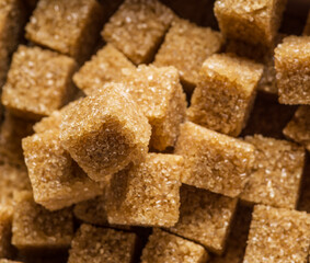 Brown sugar cubes in the paper package. Top view.