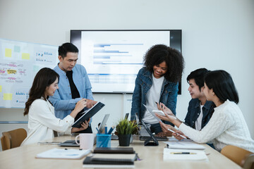 Group of professional business people are working and brainstorming discussed about work in conference room within office space.