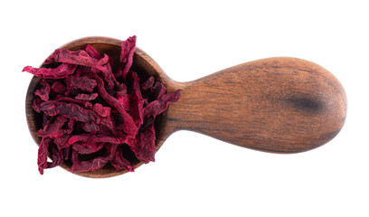 Dry beetroot in wooden spoon, isolated on the white background. Chopped dried beet. Top view.