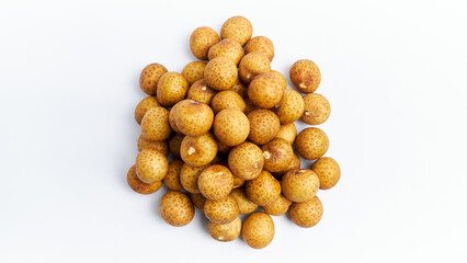 a pile of fresh longan fruit, flat lay shoot, on a white background