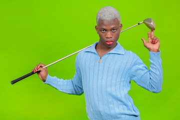 Black male gay with golf club on green background - Powered by Adobe