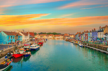 Fototapeta na wymiar The harbour at Weymouth on the Dorset coast during sunset