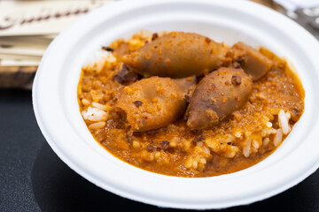 Stuffed squid with rice in its sauce at the tapa fair in Barcelona (Spain).