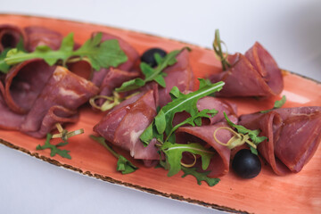 Catering table, beautifully decorated banquet with variety selection of different food snacks and appetizers on a corporate birthday party event or wedding celebration, delicatessen setting