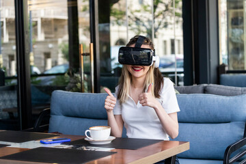 Adroable girl wearing vR set and gestures thumb up