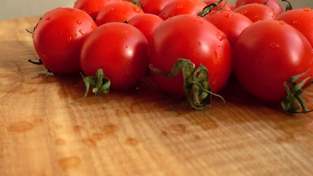 Cheries tomatoes. Shooting in the movement.