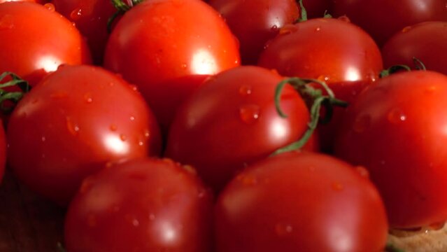 Cheries tomatoes. Shooting in the movement.
