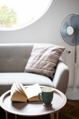 open book on a living room table