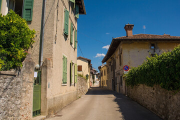 Fototapeta na wymiar A quiet back street in the historic Borgo Brossana area of Cividale del Friuli, Udine Province, Friuli-Venezia Giulia, north east Italy 