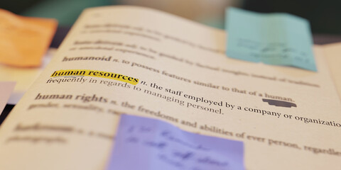 3D rendering of the definition of human resources in a dictionary, which has been annotated