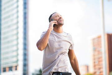 Happy man talking on mobile phone with his eyes closed