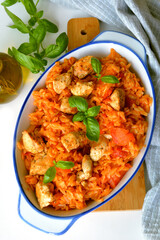 Kritharaki with tomatoes and chicken. Traditional type of Greek pasta shape of rice. Greek version of Italian Orzo