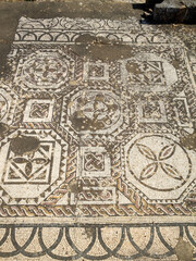 Fototapeta na wymiar Geometrical patterned mosaic of the Vila Romana de Pisões
