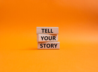 Tell your story symbol. Wooden blocks with words Tell your story. Beautiful orange background. Business and Tell your story concept. Copy space.