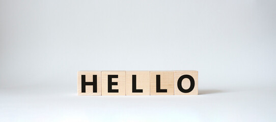 Hello symbol. Wooden cubes with word Hello. Beautiful white background. Hello concept. Copy space.