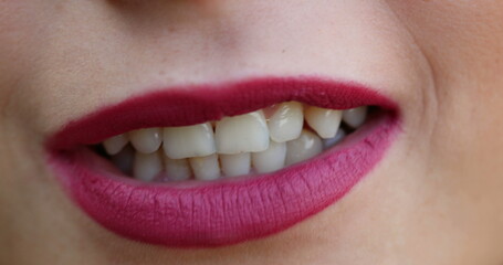 Fototapeta premium Lips macro closeup detail. Woman wearing red lipstick close-up face