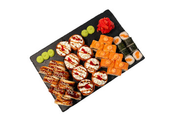 isolated set of different types of sushi on a black marble board for your menu. Sashimi. Nigiri. Chirashi. Maki. Uramaki. Temaki.