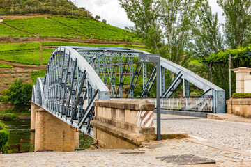 Steel bridge over the Douro river in the Alto Douro wine region near Pinhao in Portugal