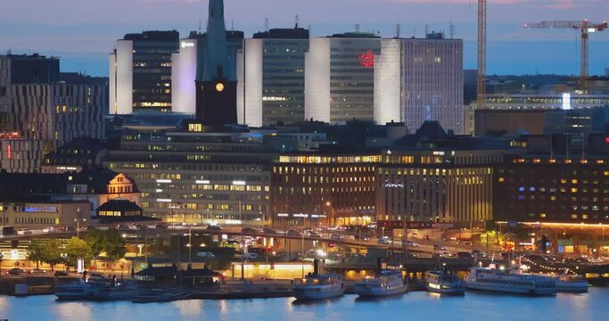Stockholm, Sweden. Night View Of Stockholm Cityscape Skyline. 4K. Building Of St. Clara Or Saint Klara Church In Summer Sunny Modern Cityscape Skyline.