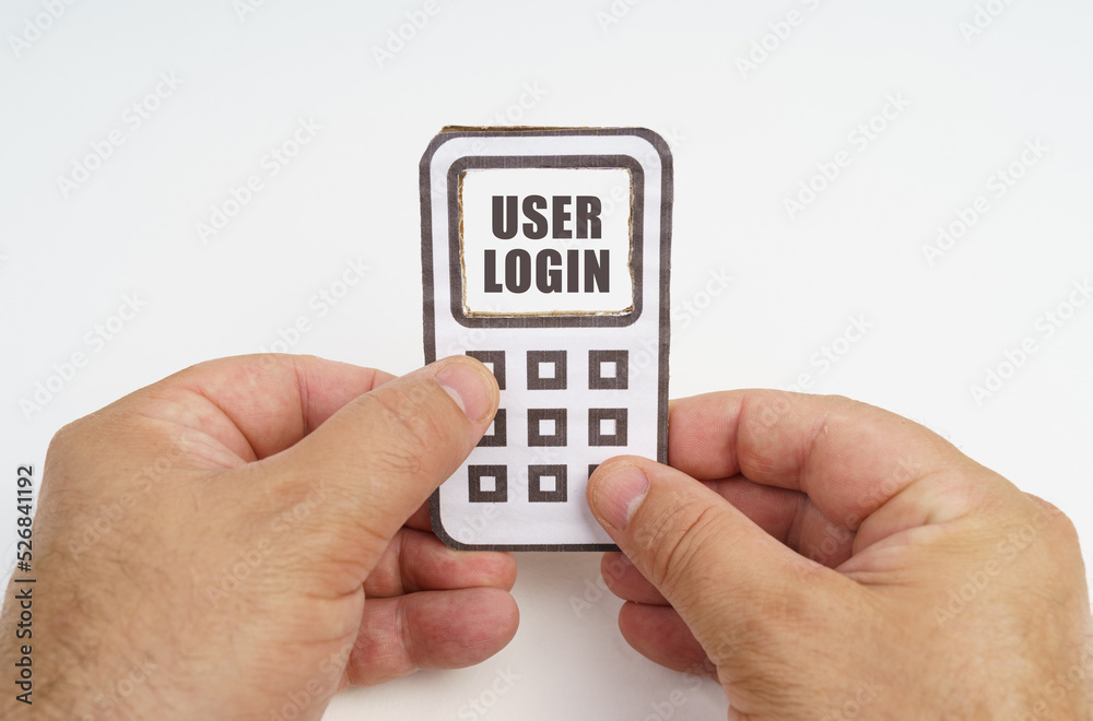 Poster in the hands of a person is a cardboard model of a telephone with an inscription on the screen - use