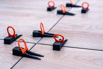 close-up of the tile alignment system holding tile in given position