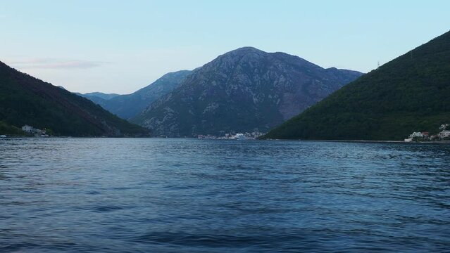 Boka Kotor Adriatic Sea, Verige Strait Kamenari Lepetane Ferry Line Trajekt. Strait between two mountains. The tourist ship sails. Tourism and business in Montenegro Maritime and water. August 16
