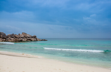 Beautiful nature of the sea tropical landscape. Exotic tropical nature of the Seychelles, a white beach surrounded by palm trees and granite rocks.