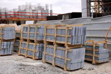 Packaged finishing marble at a construction site. Faced granite tile.