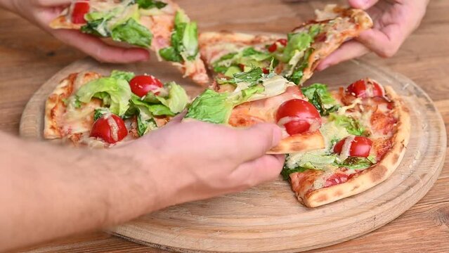 Pizza with salami and ham sausage. Italian cuisine. Side view. Free space for text. On a light wooden background. Rotates.