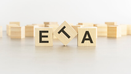 word ETA is made of wooden blocks on white background - obrazy, fototapety, plakaty