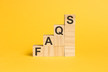 FAQS - text on wooden cubes, on wooden background