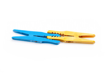 yellow and blue clothespin attached together