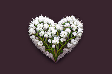 Romantic gift for valentine's day. Bouquet of white flowers in the shape of a heart. Greeting card design. Heart of flowers - A symbol of love and devotion. Surprise for the woman you love