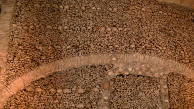 Old Wall Human Skull and Bones Ruins Inside Chapel.
Chapel of bones in Faro, Portugal, Pan shot
