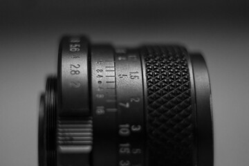 close up of a camera lens, aperture and focus ring