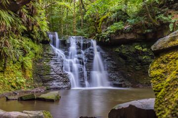 Lush vegetation surrounds Goitstock waterfalls in Yorkshire, UK