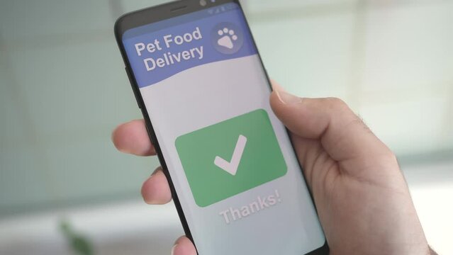 Ordering Online Some Pet Food With A Smartphone App Closeup