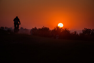 silhouette bike on sunset and bicycle background