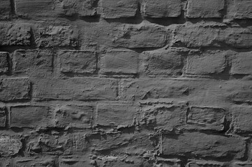 gray background, in the photo is an old brick wall close-up