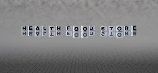 health food store word or concept represented by black and white letter cubes on a grey horizon...