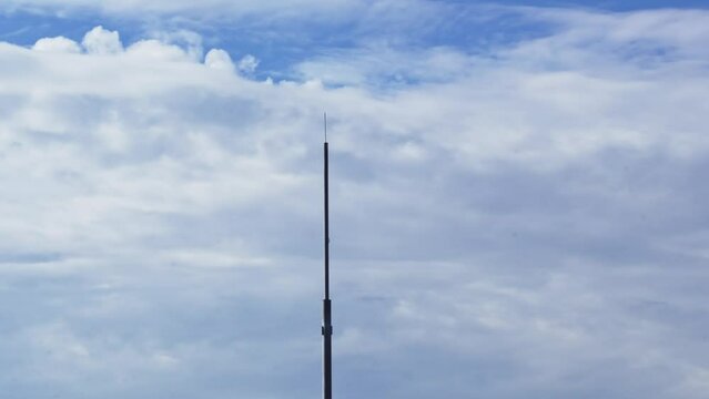 Time-lapse. cellular tower. sky with moving clouds. footage beautiful sky.