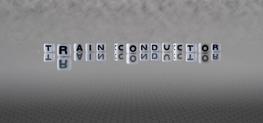 train conductor word or concept represented by black and white letter cubes on a grey horizon...