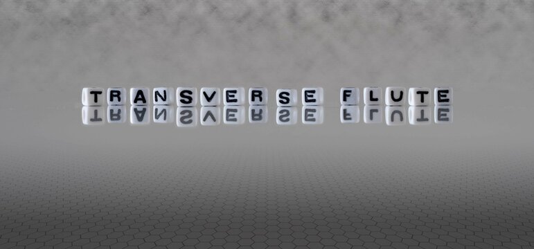 transverse flute word or concept represented by black and white letter cubes on a grey horizon background stretching to infinity