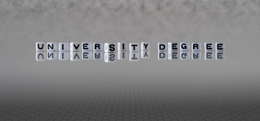 university degree word or concept represented by black and white letter cubes on a grey horizon background stretching to infinity
