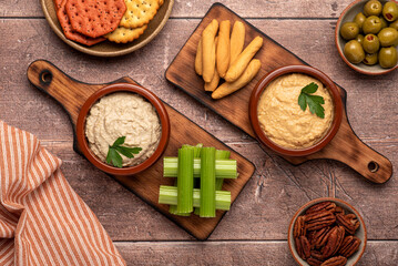 Food photography of appetizer, hummus, celery, crackers