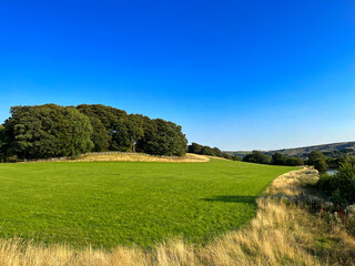 Rural landscape near Farnhill, with the Leeds and Liverpool canal, in the distance in, Farnhill, Keighley, UK