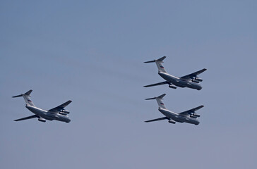 MOSCOW, RUSSIA - MAY 7, 2021: Avia parade in Moscow. 3 Ilyushin Il-76 multi-purpose four-engined strategic airlifters fly in the sky on parade of Victory in World War II in Moscow, Russia