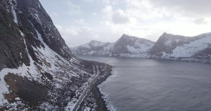 Long road at the coastline with mountains in norway lofoten