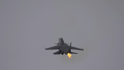 Moscow Russia Zhukovsky Airfield 25 July 2021: aerobatic Su-30 perfoming demonstration flight Engine surge, nozzle fire