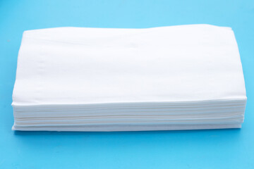Facial tissue on blue background.